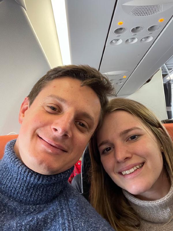 A couple inside a plane